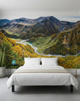 Mountain landscape wallpaper featuring turquoise river winding through autumn valleys