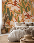 Stylized, sizable blooms rendered in a palette of deep amber and reddish-brown (terracotta) hues wallpaper
