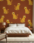 Amber Glimmer Terracotta Leopard Print Wallpaper adding character to a cozy bedroom