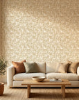 Amber Mosaic golden geometric peel and stick wallpaper in a warm and inviting living room