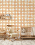 Amber Weave rustic orange plaid wallpaper bringing warmth to a peaceful nursery