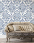 Amber Blossom Ballet removable wallpaper with slate blue damask pattern behind vintage tufted sofa