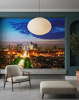 Paris cityscape twilight mural wallpaper featuring illuminated streets and dramatic blue sky in modern living room