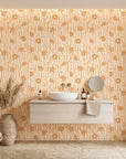 Apricot Tides warm coastal seashell wallpaper creating ambiance in a serene bathroom