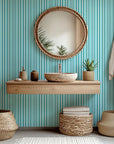 Self-adhesive wallpaper featuring vertical stripes in teal and white, named Aqua Rhythm