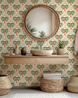 Geometric palm wallpaper with repeating scalloped arches and stylized palm trees in olive green, terracotta, and warm sand tones on a light cream background.