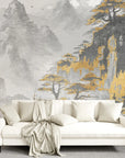 Asian Mountains wallpaper mural with gray misty peaks and golden trees on modern living room wall