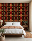 Aztec Echoes red and black tribal geometric wallpaper adding character to a cozy bedroom