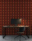 Aztec Echoes red and black tribal geometric wallpaper as a feature wall in a bright home office