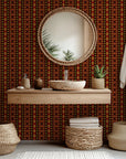 Self-adhesive wallpaper featuring a red and black geometric Southwest tribal pattern, known as Aztec Echoes