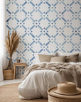 A clean white field featuring a minimalist dotted lattice in blue, evoking a refreshing coastal aesthetic