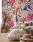 A vibrant Azure Aloha wallpaper design featuring pink hibiscus blooms and silhouettes of palm fronds