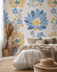 Self-adhesive, removable wallpaper featuring a folk art style pattern of yellow and blue flowers