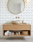 Azure Whisper blue sage wallpaper creating ambiance in a serene bathroom