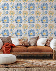Self-adhesive, removable wall covering featuring a folk art pattern of yellow and blue flowers