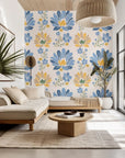 Self-adhesive, removable wall covering featuring a folk art pattern of blue and yellow flowers