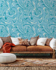 Self-adhesive wallcovering featuring a flowing blue and white abstract marble pattern, known as the Azure Dance design