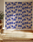 Tropical botanical wallpaper styled in a hallway, delivering a striking coastal look with elegant palm illustrations.