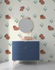 Charming nursery wallpaper with illustrated brown capybaras and soft blue tulips - Azure Meadows