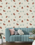 Removable wallpaper design showing a repeating pattern of capybaras and blue flowers - Azure Meadows