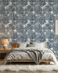 Batik Indigo textured blue floral wallpaper in a warm and inviting living room