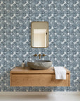 Batik Indigo textured blue floral wallpaper as a feature wall in a bright home office