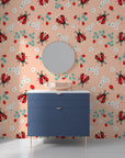 Minimalist peach backdrop adorned with detailed ladybug and strawberry illustrations on a removable vinyl surface. - Berry Wings