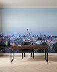 Between Two Worlds city skyline mural wallpaper with blue twilight tones on modern home office wall