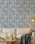 Birch & Shadow grey abstract wallpaper in a warm and inviting living room