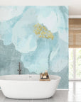 Blue Daydreams abstract watercolor wallpaper with aqua brushstrokes and gold accent in modern bathroom