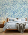 Blue Mirage coastal abstract peel and stick wallpaper adding character to a cozy bedroom