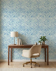 Blue Mirage coastal abstract peel and stick wallpaper as a feature wall in a bright home office