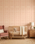 Blush Ikat peach and pink abstract wallpaper as a feature wall in a bright home office