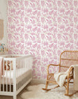 Blush Tropics pink botanical peel and stick wallpaper as a feature wall in a bright home office