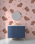 Charming nature-inspired wall covering featuring earthy-toned capybaras and pastel pink floral accents - Blush Blooms