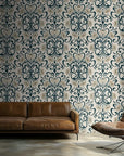 A decorative paper with a flower and vine pattern, characteristic of Art Nouveau. It displays curving dark teal elements and pale ivory blooms on a creamy porcelain backdrop.