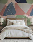 An abstract wallpaper design in the mid-century modern style, characterized by intersecting thin lines and layered organic forms in a palette of navy blue, soft gray, muted pink, and sage green