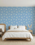 Borrowed Blue serene blue botanical sprig wallpaper adding character to a cozy bedroom