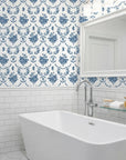 Botanica Grace classic blue rose toile wallpaper creating ambiance in a serene bathroom