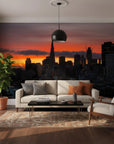 Burning Horizon cityscape wallpaper with orange sunset sky and dark silhouetted buildings on modern living room wall