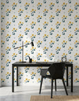 Buttercup Meadow yellow floral wallpaper as a feature wall in a bright home office