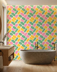 Candy Cobbles colorful retro geometric brick wallpaper creating ambiance in a serene bathroom