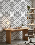 Carbon Bloom grey floral peel and stick wallpaper as a feature wall in a bright home office