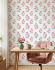 Carnation Lattice pink and blue floral wallpaper as a feature wall in a bright home office