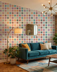 Carnival Cloth vibrant multicolor polka dot wallpaper in a warm and inviting living room
