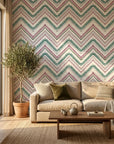 Carnival Stripe teal and burgundy chevron wallpaper adding character to a cozy bedroom