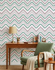 Carnival Stripe teal and burgundy chevron wallpaper as a feature wall in a bright home office