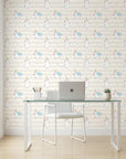 Celestial Prance pink and gold unicorn wallpaper as a feature wall in a bright home office