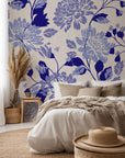 Self-adhesive, removable wall covering featuring an elegant blue floral pattern on an ivory ground, known as Cerulean Cascade