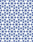 Self-adhesive wallpaper featuring a blue and white Moroccan star tile pattern, Cerulean Echoes
